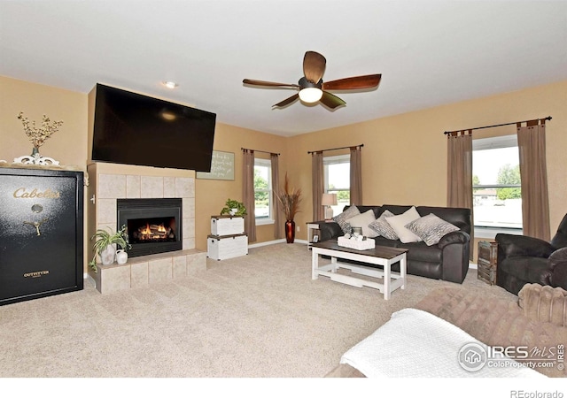 405 Ridgeview Ct, Johnstown, CO 80534 - carpeted living area featuring ceiling fan and a fireplace