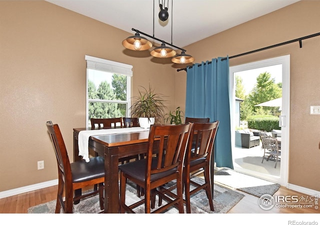 405 Ridgeview Ct, Johnstown, CO 80534 - dining space with wood finished floors and baseboards
