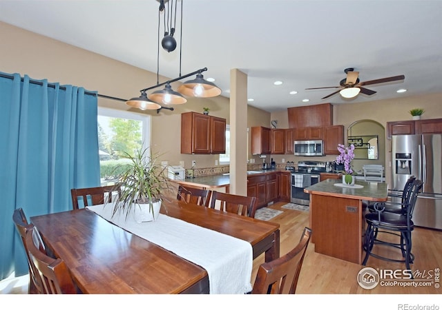 405 Ridgeview Ct, Johnstown, CO 80534 - dining room featuring light wood-type flooring, a ceiling fan, and recessed lighting