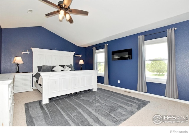 405 Ridgeview Ct, Johnstown, CO 80534 - carpeted bedroom with vaulted ceiling and ceiling fan