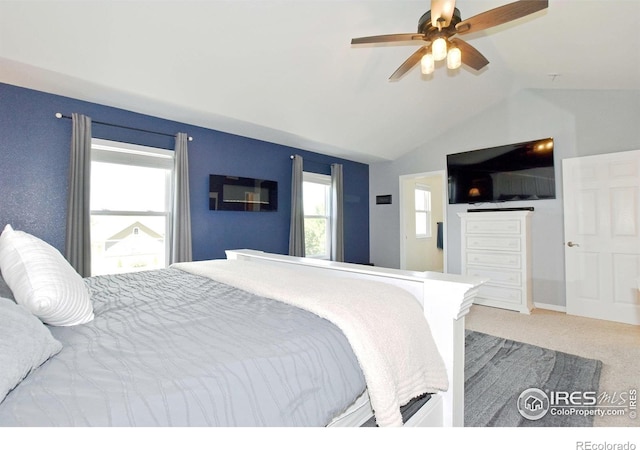 405 Ridgeview Ct, Johnstown, CO 80534 - carpeted bedroom with vaulted ceiling and a ceiling fan