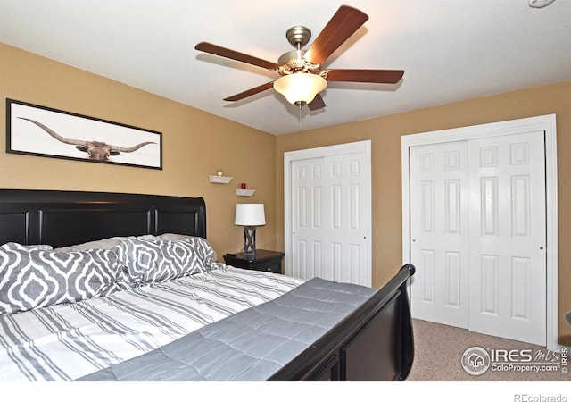 405 Ridgeview Ct, Johnstown, CO 80534 - carpeted bedroom with multiple closets and ceiling fan