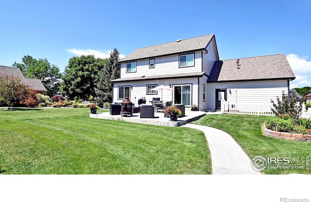 405 Ridgeview Ct, Johnstown, CO 80534 - rear view of house with a yard and a patio