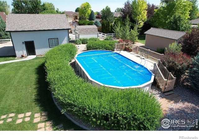 405 Ridgeview Ct, Johnstown, CO 80534 - outdoor pool featuring a wooden deck, a yard, a storage shed, and stairway