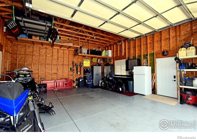 405 Ridgeview Ct, Johnstown, CO 80534 - garage featuring freestanding refrigerator