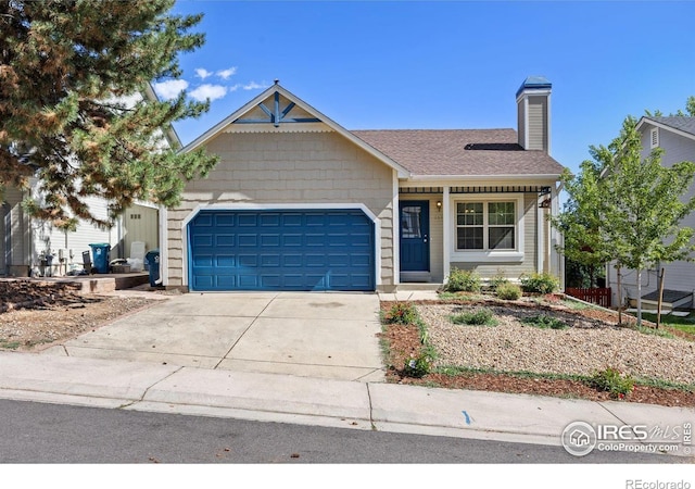 253 W Cedar Way, Louisville, CO 80027 - view of front facade with an attached garage, concrete driveway, a chimney, and a shingled roof