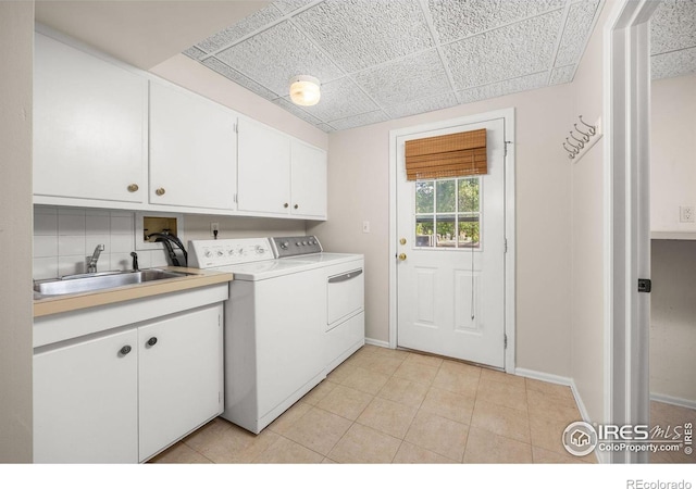 253 W Cedar Way, Louisville, CO 80027 - washroom with cabinet space, washer and dryer, and light tile patterned flooring