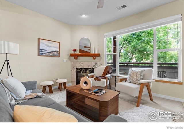 5220 Boardwalk Dr Unit 22, Fort Collins, CO 80525 - living room featuring a fireplace, carpet floors, and a ceiling fan
