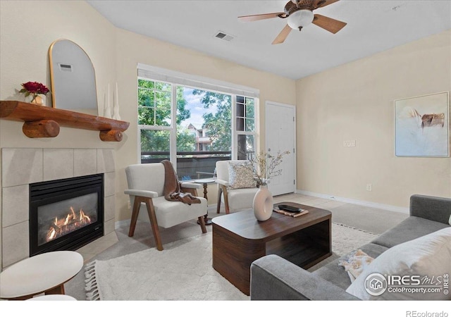 5220 Boardwalk Dr Unit 22, Fort Collins, CO 80525 - living room featuring a tiled fireplace and ceiling fan