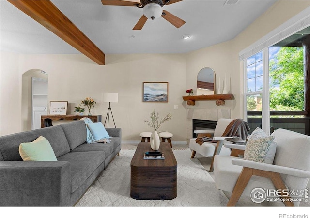 5220 Boardwalk Dr Unit 22, Fort Collins, CO 80525 - living room featuring a ceiling fan, arched walkways, a fireplace, beamed ceiling, and recessed lighting