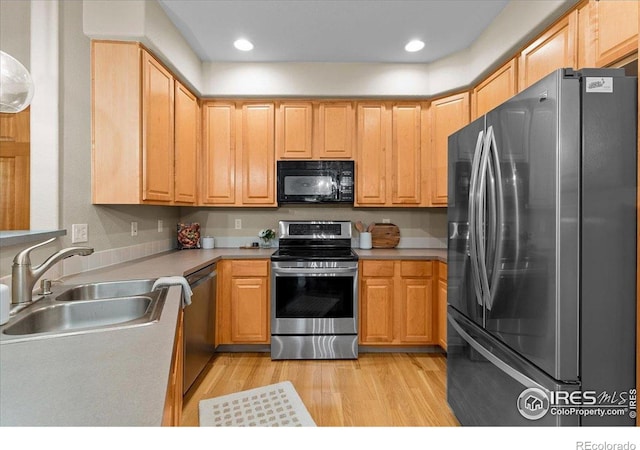 5220 Boardwalk Dr Unit 22, Fort Collins, CO 80525 - kitchen with stainless steel appliances, light countertops, light wood-style flooring, and recessed lighting