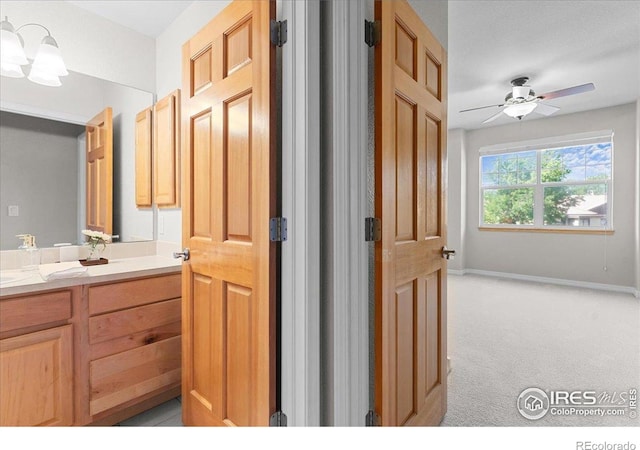 5220 Boardwalk Dr Unit 22, Fort Collins, CO 80525 - bathroom featuring double vanity and ceiling fan