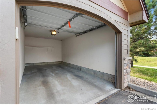 5220 Boardwalk Dr Unit 22, Fort Collins, CO 80525 - garage featuring a garage door opener