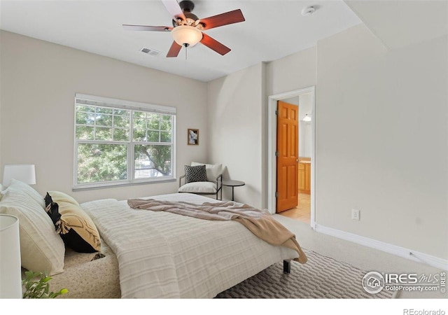 5220 Boardwalk Dr Unit 22, Fort Collins, CO 80525 - bedroom featuring light carpet, ceiling fan, and ensuite bathroom