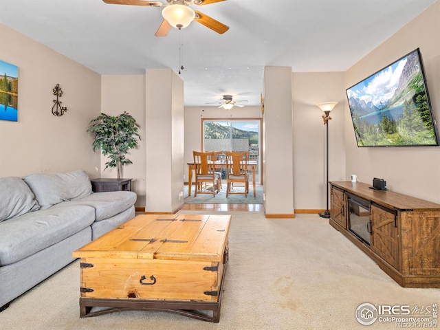 1695 Gray Hawk Ct, Estes Park, CO 80517 - living room featuring ceiling fan and light colored carpet