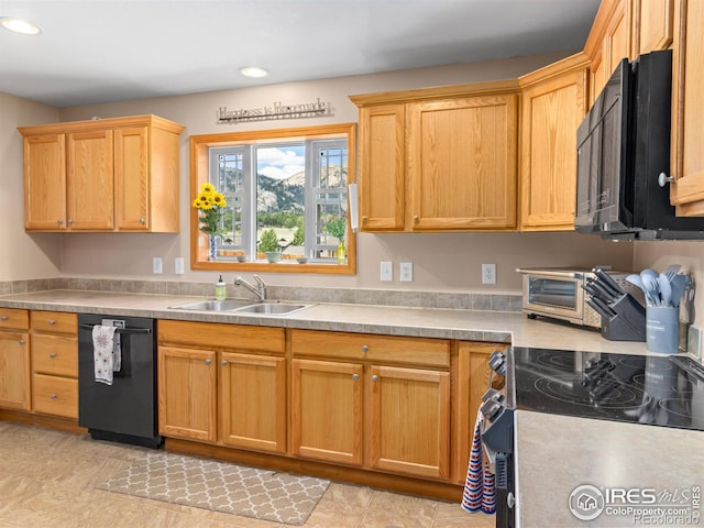1695 Gray Hawk Ct, Estes Park, CO 80517 - kitchen with black appliances, recessed lighting, and light countertops