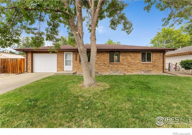 530 Mount Evans St, Longmont, CO 80504 - ranch-style home with driveway, a garage, and brick siding
