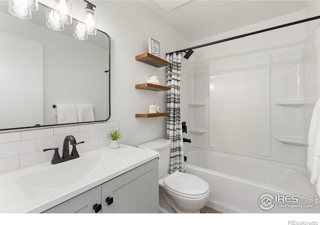 530 Mount Evans St, Longmont, CO 80504 - bathroom featuring decorative backsplash, shower / bathtub combination with curtain, and vanity