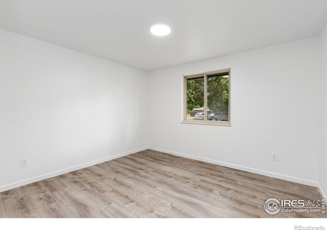 530 Mount Evans St, Longmont, CO 80504 - empty room featuring wood finished floors and baseboards
