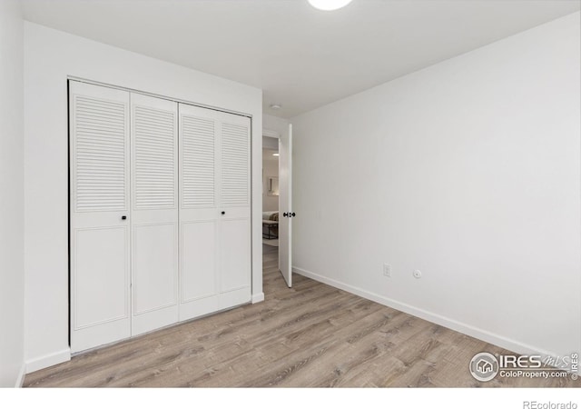 530 Mount Evans St, Longmont, CO 80504 - unfurnished bedroom featuring wood finished floors and a closet
