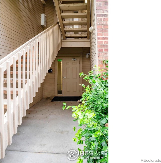 1830 W Centennial Dr Unit 108, Louisville, CO 80027 - doorway to property with brick siding