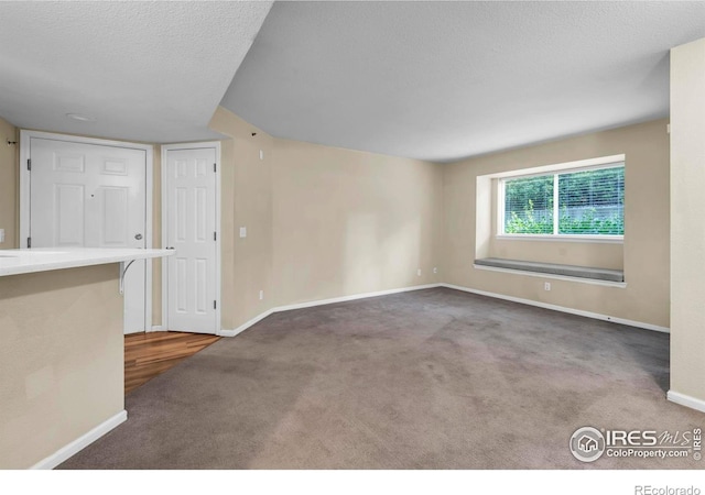 1830 W Centennial Dr Unit 108, Louisville, CO 80027 - unfurnished room with carpet and a textured ceiling
