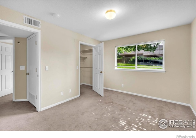 1830 W Centennial Dr Unit 108, Louisville, CO 80027 - unfurnished bedroom featuring carpet and a spacious closet