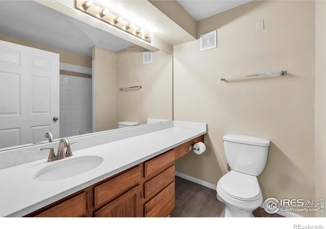 1830 W Centennial Dr Unit 108, Louisville, CO 80027 - bathroom featuring vanity, wood finished floors, and a shower