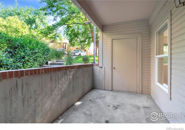 1830 W Centennial Dr Unit 108, Louisville, CO 80027 - view of exterior entry featuring a balcony
