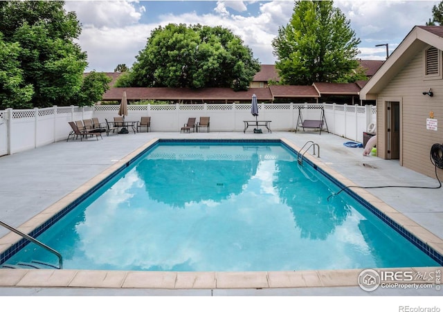 1830 W Centennial Dr Unit 108, Louisville, CO 80027 - view of swimming pool with a patio