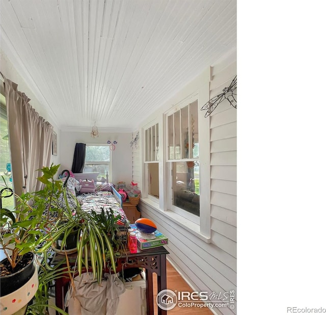 329 S Wynona Ave, Holyoke, CO 80734 - sunroom / solarium with wood finished floors and crown molding