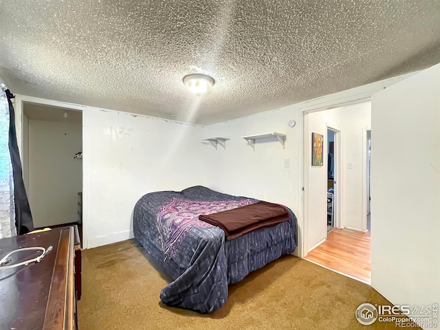 329 S Wynona Ave, Holyoke, CO 80734 - bedroom with carpet flooring and a textured ceiling