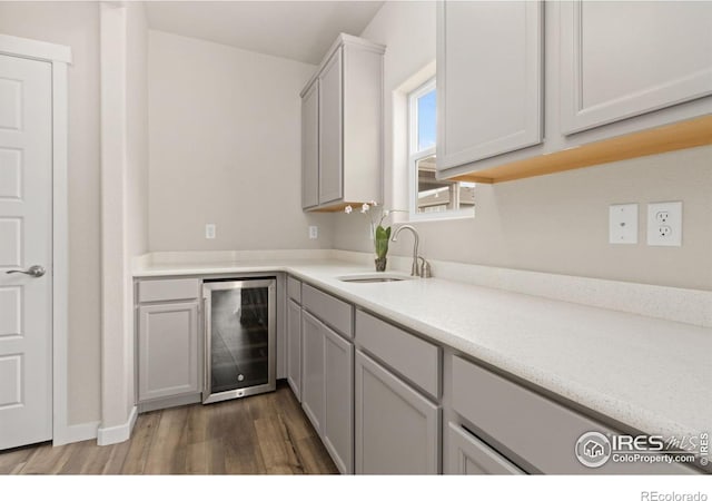963 Milner Pass Rd, Severance, CO 80550 - kitchen featuring wine cooler, wood finished floors, and light countertops