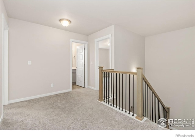963 Milner Pass Rd, Severance, CO 80550 - corridor with carpet flooring and an upstairs landing