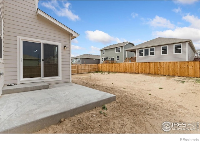 963 Milner Pass Rd, Severance, CO 80550 - fenced backyard featuring a patio area and a residential view