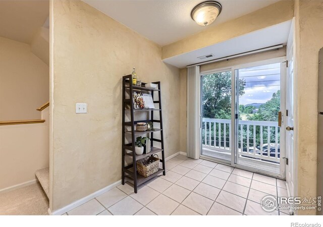 4919 Noble Park Pl, Boulder, CO 80301 - entryway featuring light tile patterned floors and stairs