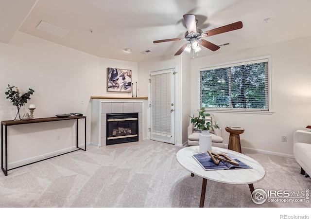 4919 Noble Park Pl, Boulder, CO 80301 - carpeted living area with a tile fireplace and a ceiling fan