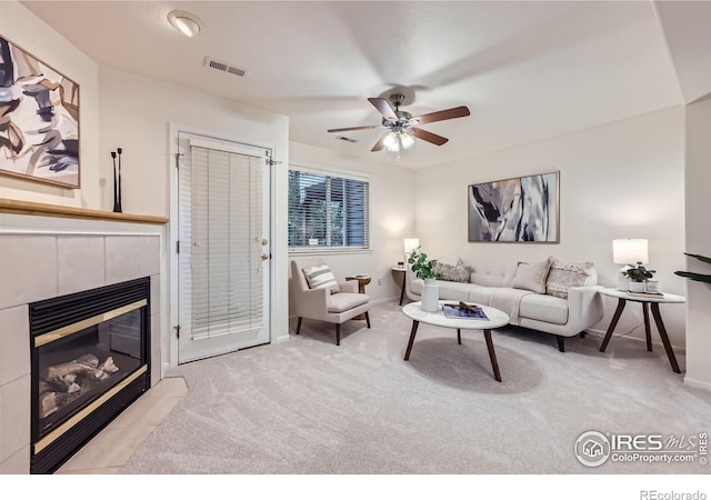 4919 Noble Park Pl, Boulder, CO 80301 - carpeted living room with a tile fireplace and a ceiling fan