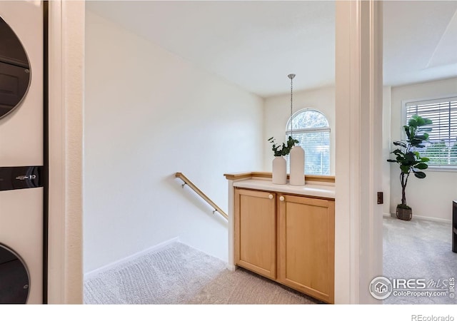 4919 Noble Park Pl, Boulder, CO 80301 - bathroom featuring stacked washer and clothes dryer and baseboards