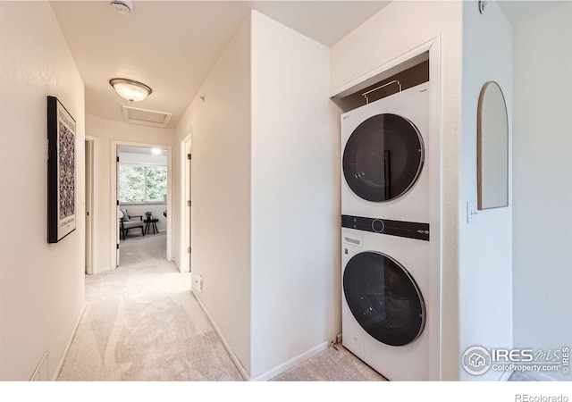 4919 Noble Park Pl, Boulder, CO 80301 - laundry room with stacked washer and clothes dryer, attic access, and carpet flooring
