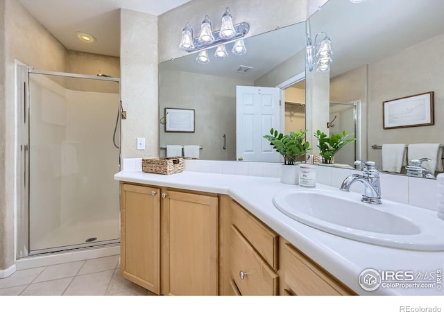 4919 Noble Park Pl, Boulder, CO 80301 - bathroom with a stall shower, vanity, and tile patterned flooring
