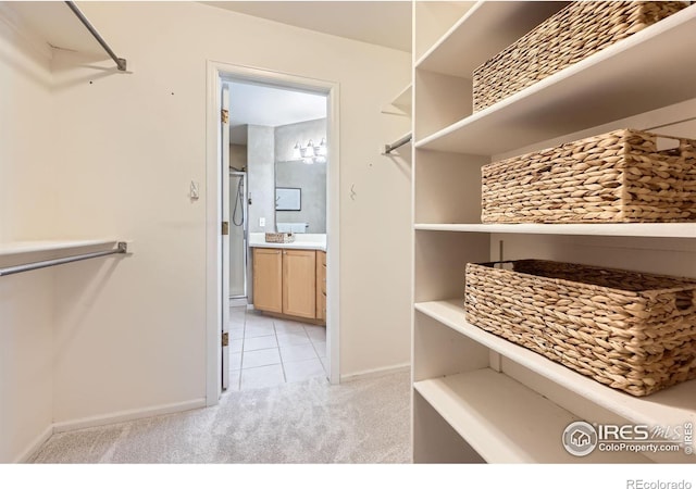 4919 Noble Park Pl, Boulder, CO 80301 - spacious closet with light colored carpet and light tile patterned floors