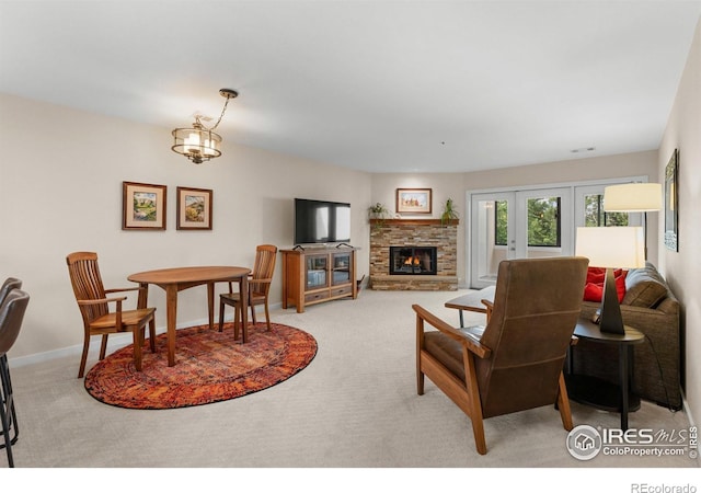 337 Arapahoe Ave Unit 303, Boulder, CO 80302 - living room featuring light carpet, a fireplace, and french doors