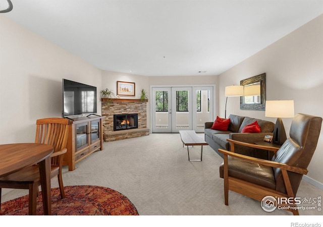 337 Arapahoe Ave Unit 303, Boulder, CO 80302 - living area with carpet and a stone fireplace