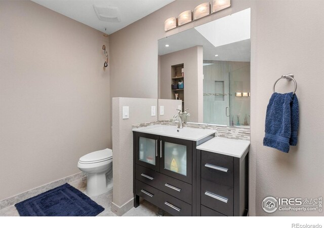337 Arapahoe Ave Unit 303, Boulder, CO 80302 - full bath featuring vanity, a shower with shower door, and backsplash