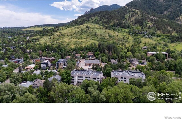 337 Arapahoe Ave Unit 303, Boulder, CO 80302 - aerial view of a forest and mountains