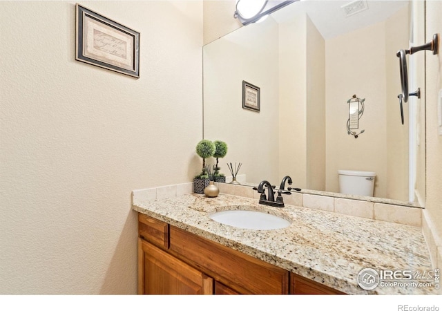 8119 Lighthouse Ln, Windsor, CO 80528 - bathroom with vanity and toilet