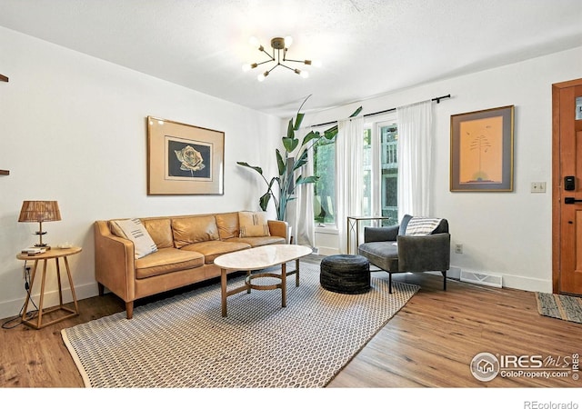 3850 Broadway St Unit 24, Boulder, CO 80304 - living room with a chandelier and light wood-style flooring