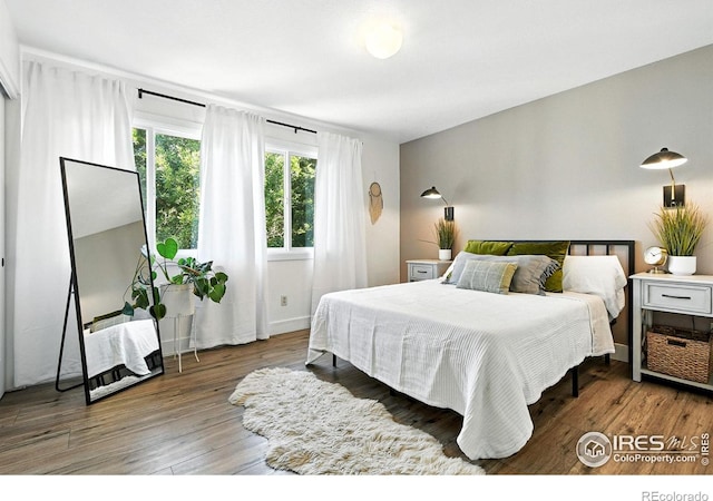 3850 Broadway St Unit 24, Boulder, CO 80304 - bedroom with wood finished floors and baseboards