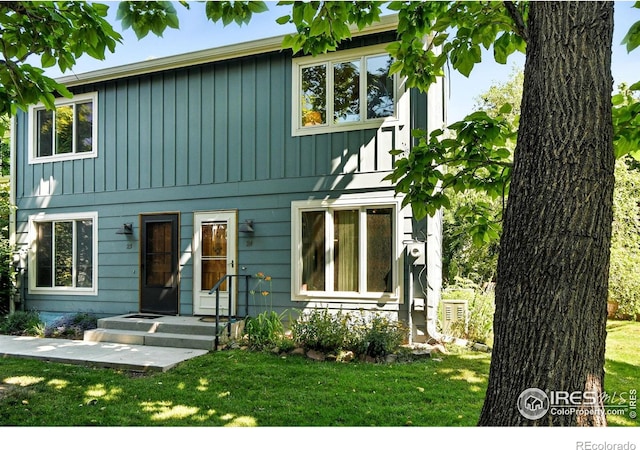 3850 Broadway St Unit 24, Boulder, CO 80304 - view of front of house with a front yard and board and batten siding